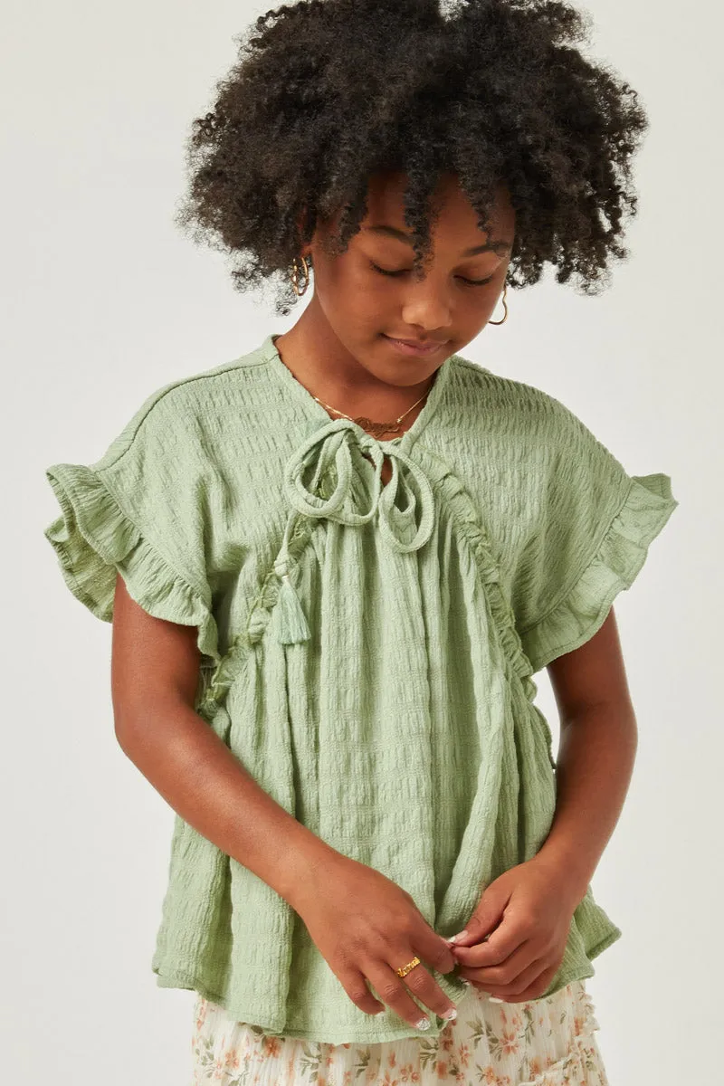Textured Ruffle Seamed Tassel Tie Top